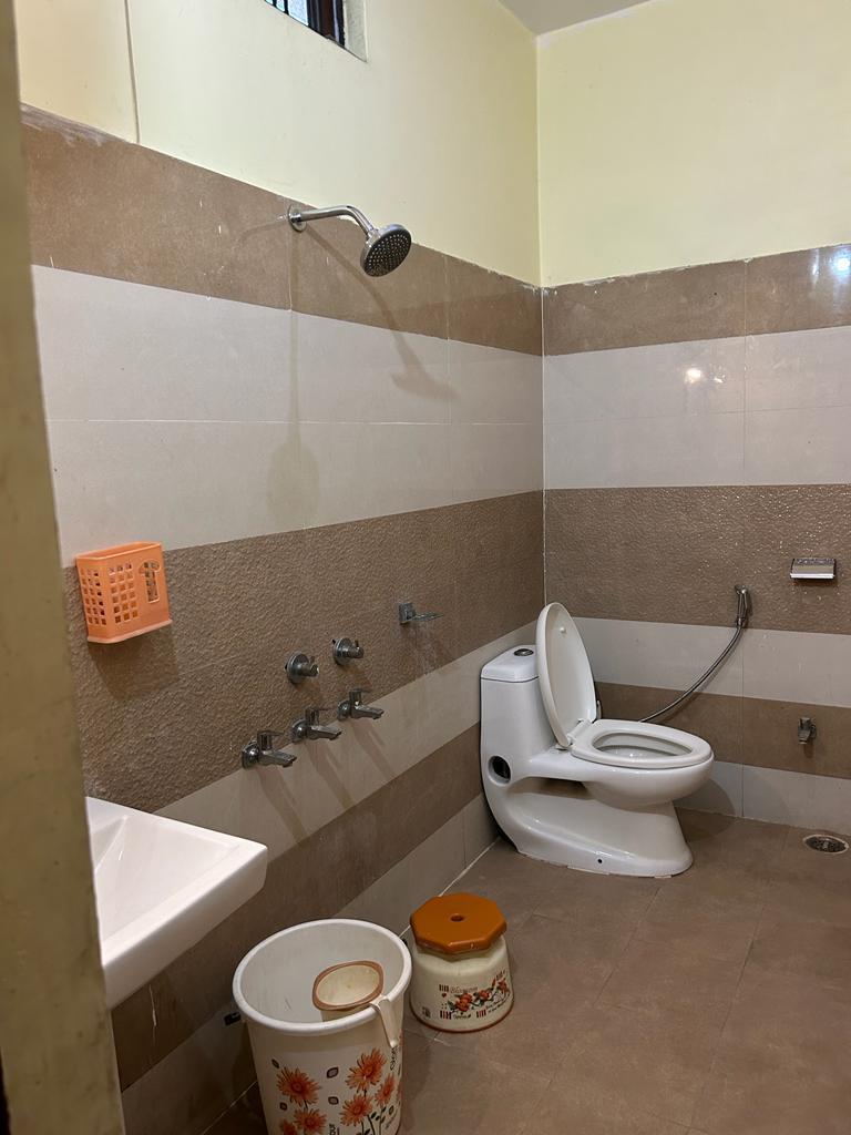 Clean Bathroom Facility with Geyser
